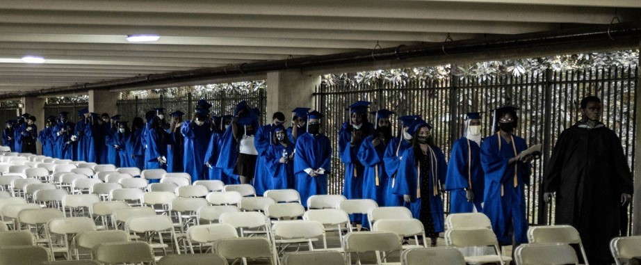 Graduates in marching in a line